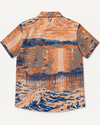 Back of the Last Light at Stearns shirt with an orange and blue sunset reflected across water.
